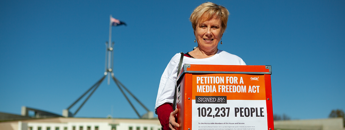 Member holding 100,000 signature petition