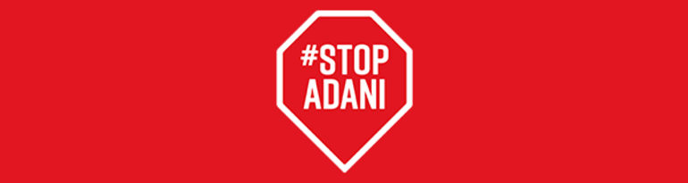 Text that says #StopAdani in a heptagon