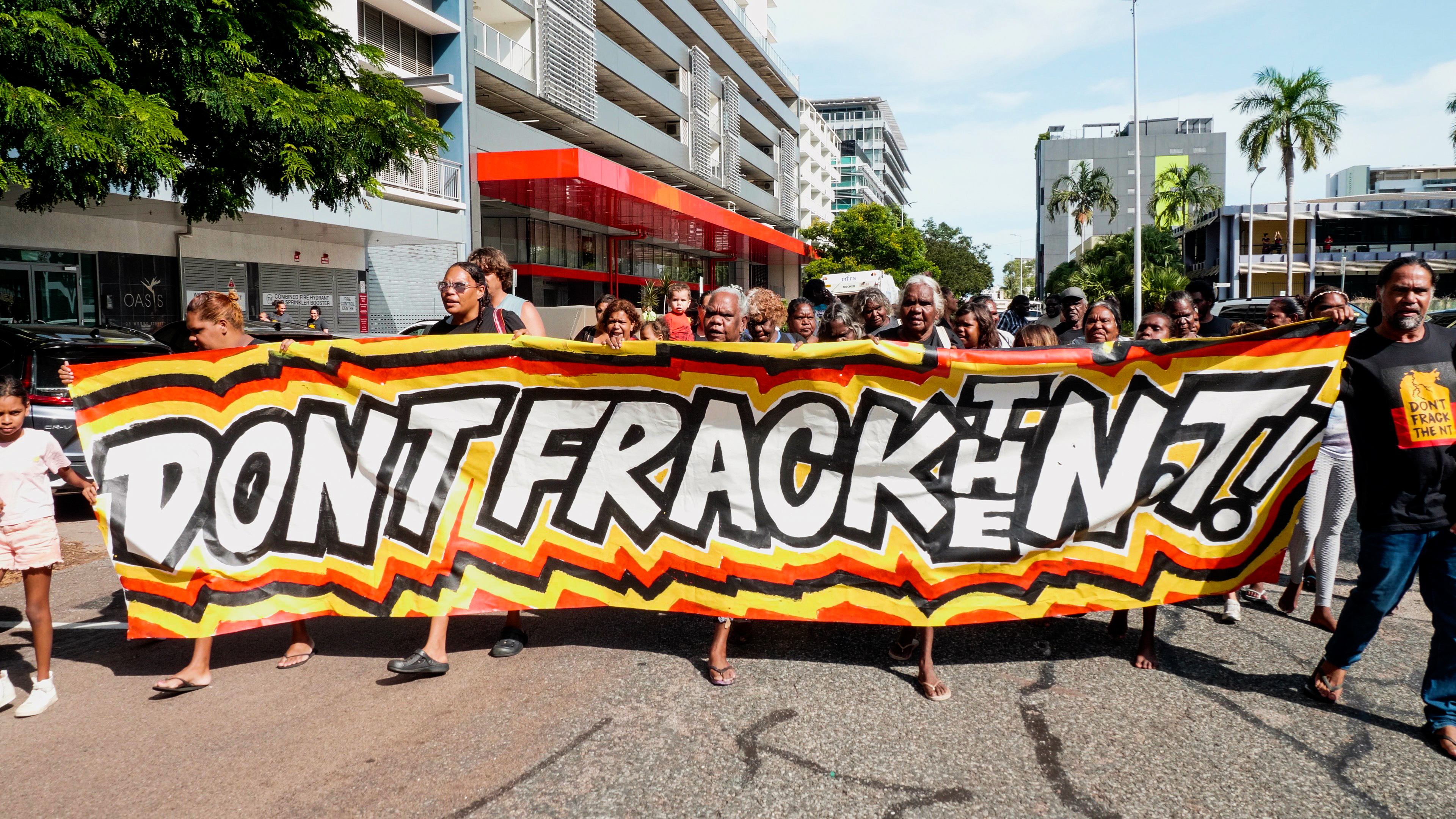 Traditional Owners outside the fracking inquiry with a banner saying Don't Frack the NT